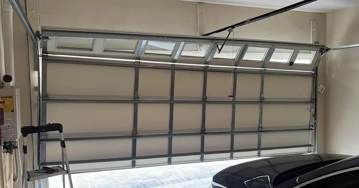 Atlantic Garage Door Repair technician servicing a residential garage door in Palm Coast Florida
